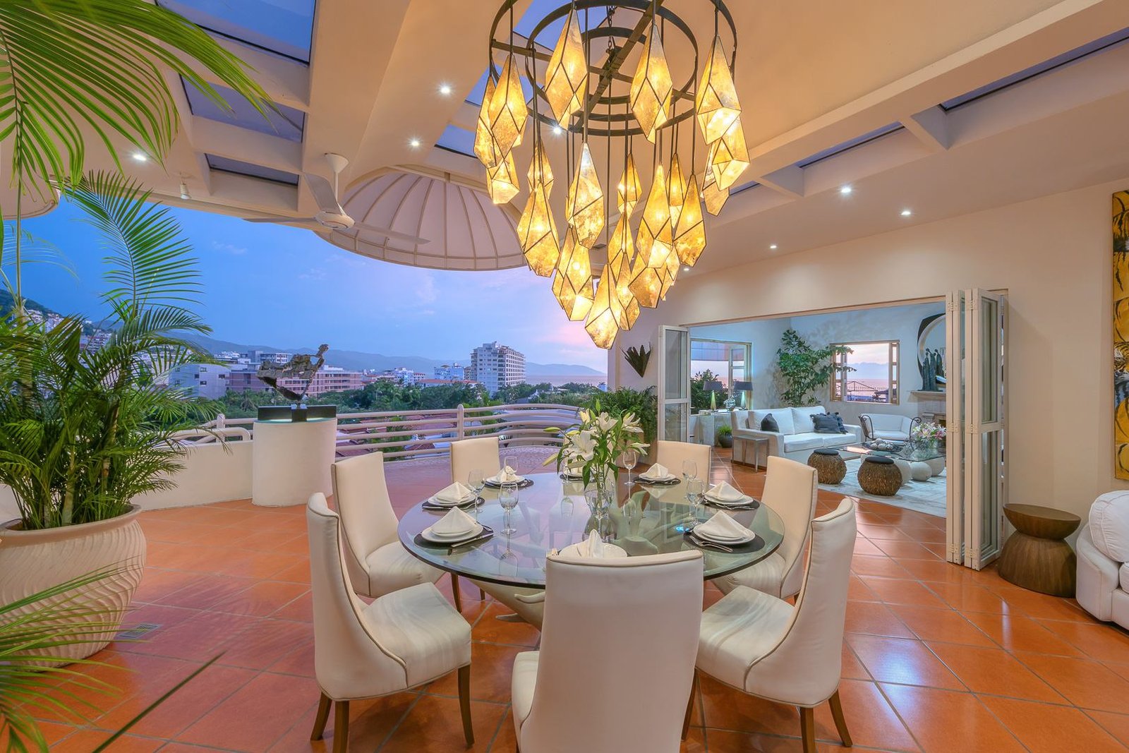 Open-air dining room with chandelier